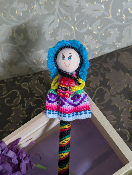 Doll Pen - Holding a small bag -Teal Hat - Made in Peru