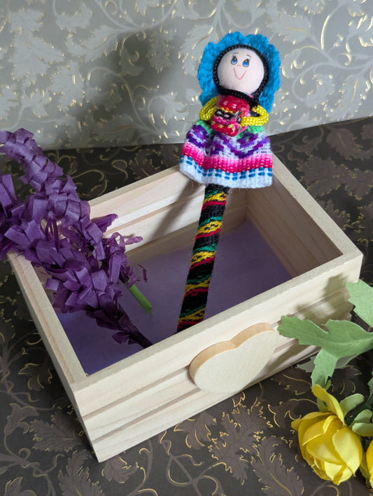 Doll Pen - Holding a small bag -Teal Hat - Made in Peru