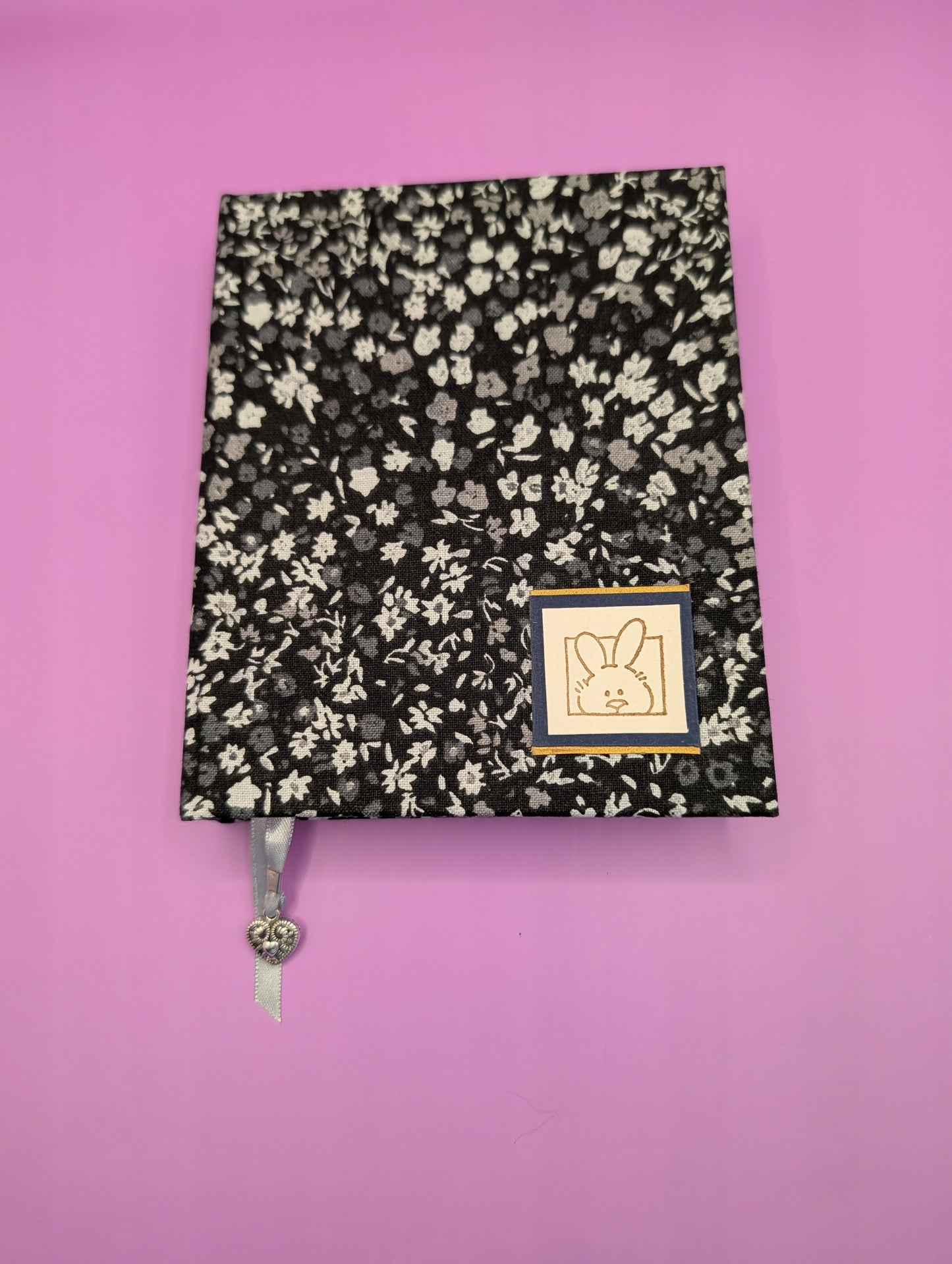 Tiny Black and Gray Flowers on black background with a little bunny head print as embellishment - Handmade Fabric Journal