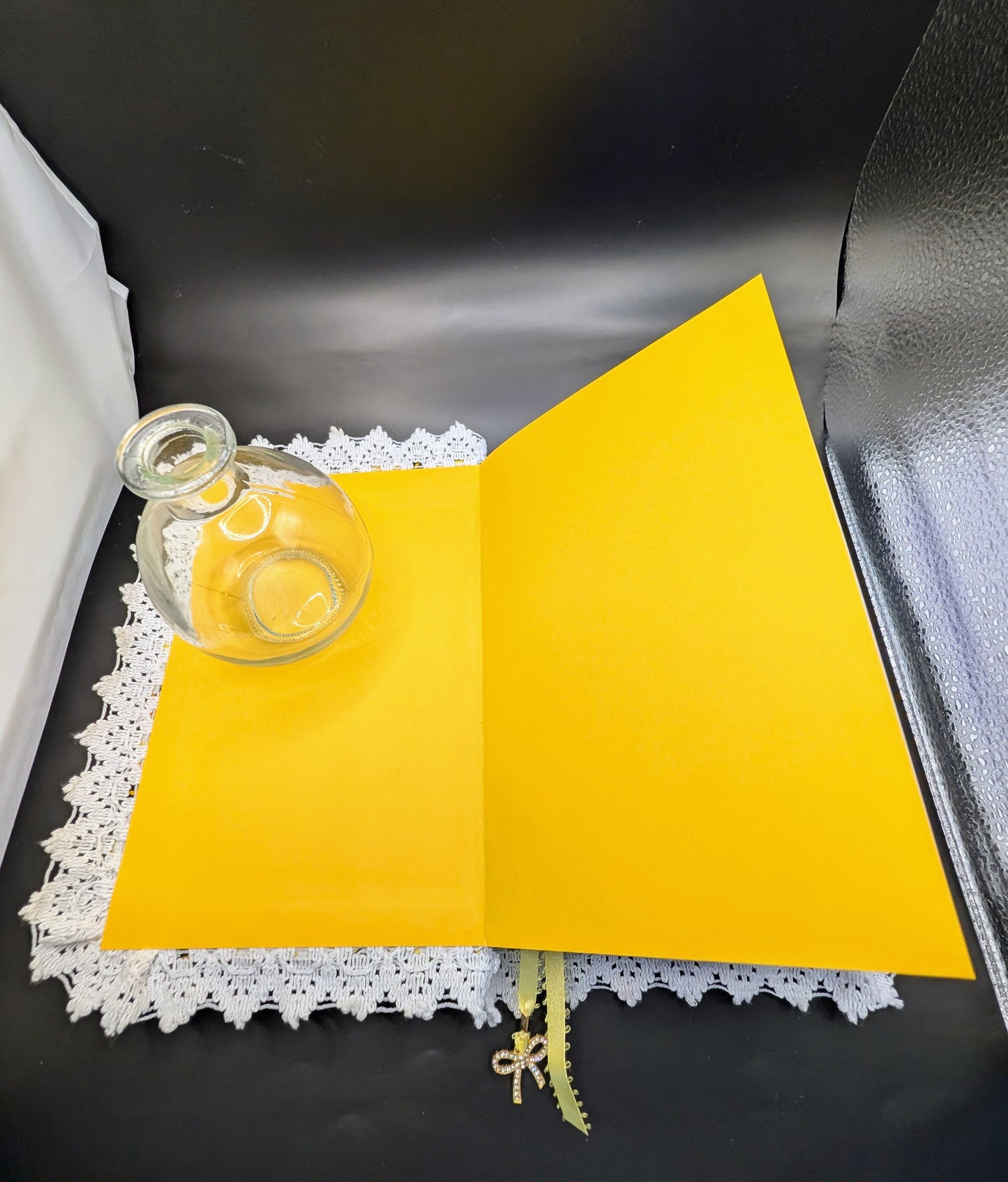 Handmade fabric and lace journal with honeybee pattern for journaling and scrapbooking. Showing inner pages in acid-free yellow cardstock, white cotton lace.
