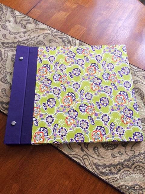 14 x 14 custom album, with 12x12 acid free pages ready to be worked on. Japanese paper was used for the covers and purple bookcloth from Germany for the spine.