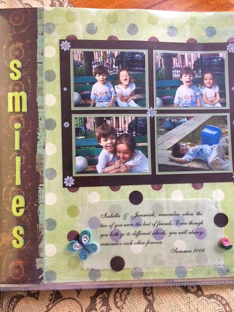 A custom-designed scrapbooking page with multiple photo frames, a green background, and the word 'SMILES' in bold lettering. The page also features a floral design element and several decorative buttons.